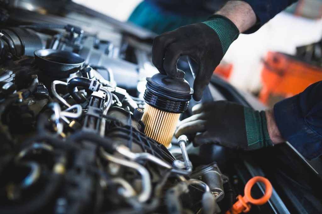a person working on a car engine